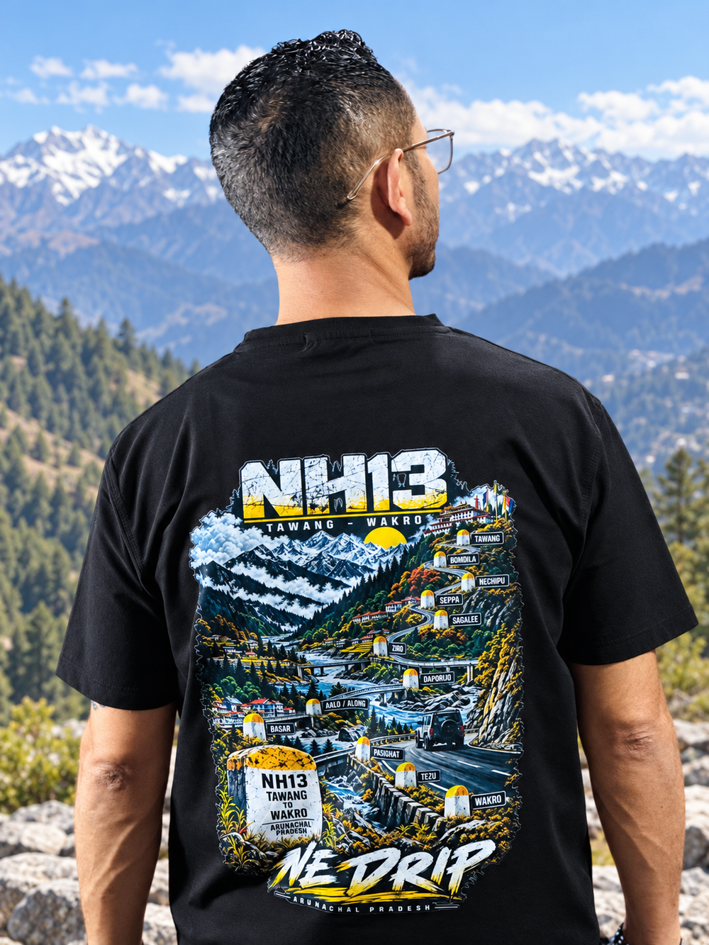 Edited lifestyle photograph — NH13 black T-shirt worn by model outdoors in the mountains