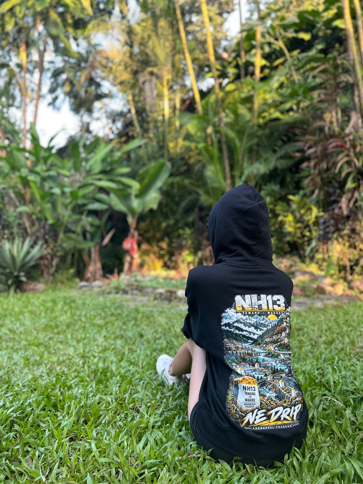NH13 black hoodie worn by model, new Tawang-to-Wakro back print
